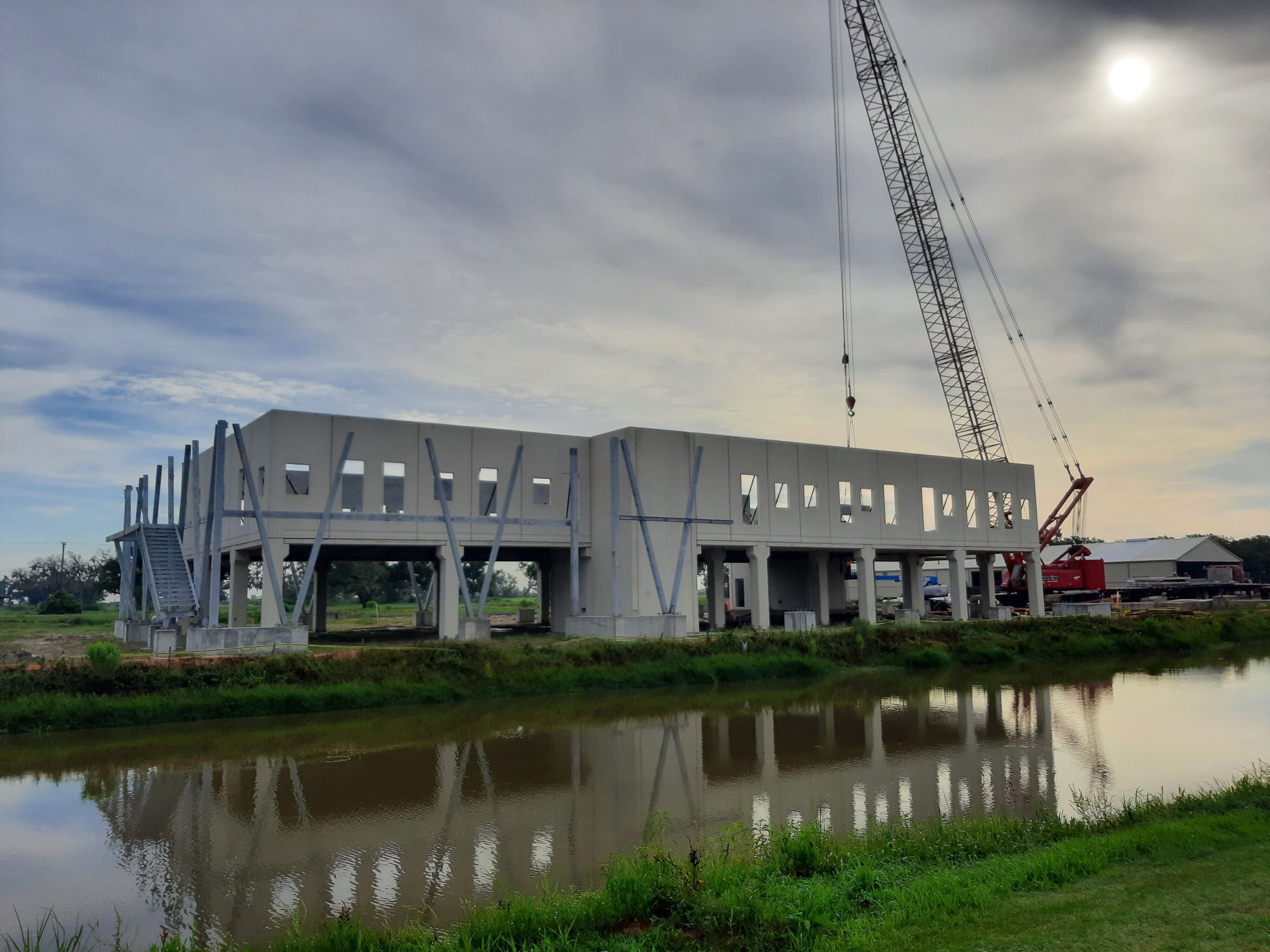 precast concrete structure located next to a body of water in a marsh